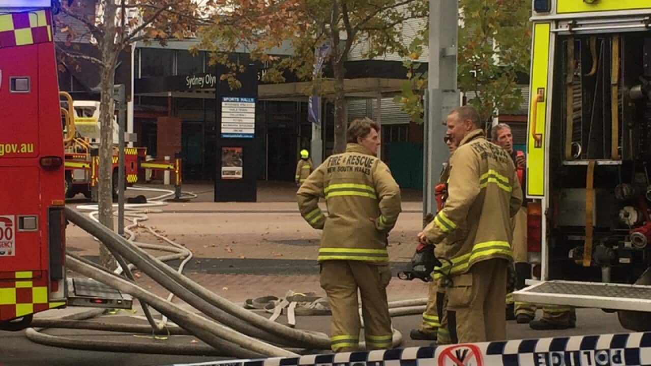 Firefighters attend a building fire at the Sydney Olympic Park