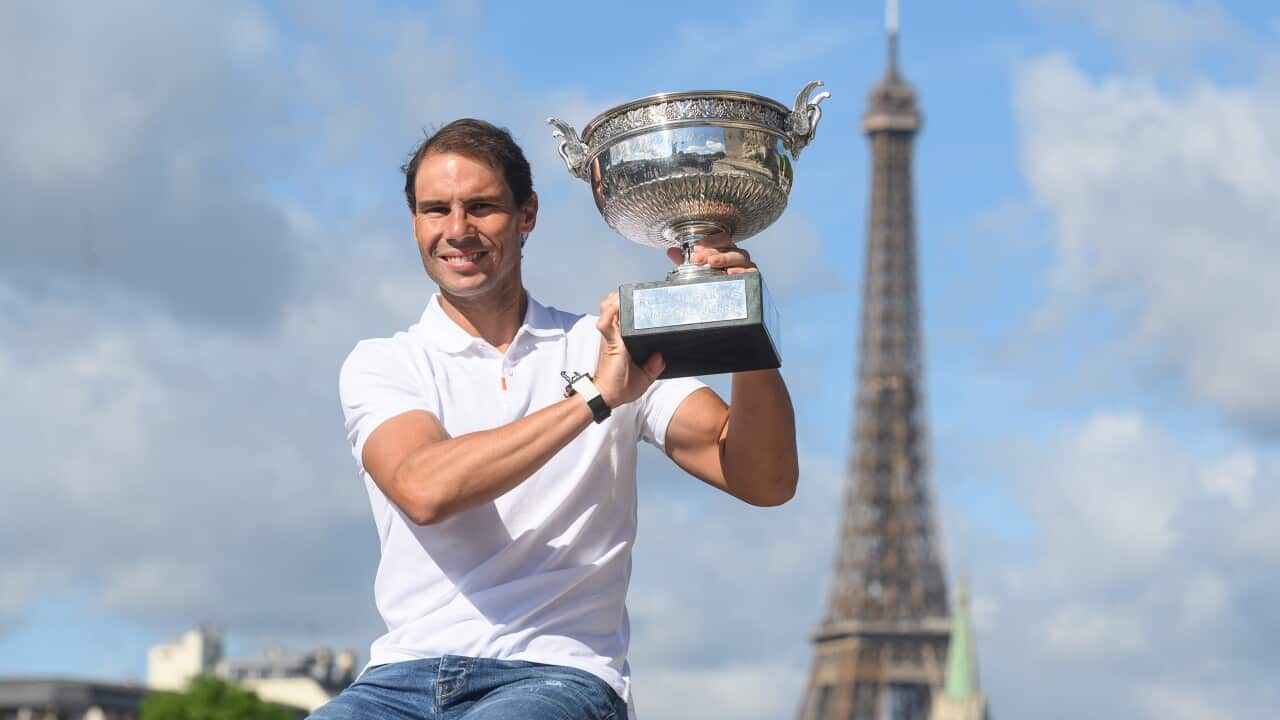 Rafael Nadal of Spain poses for a picture with the Musketeers Cup during a photoshoot for his 14th victory at Roland Garros on June 6, 2022 at Alexandre III bridge in Paris, France. Photo by Laurent Zabulon/ABACAPRESS.COM.