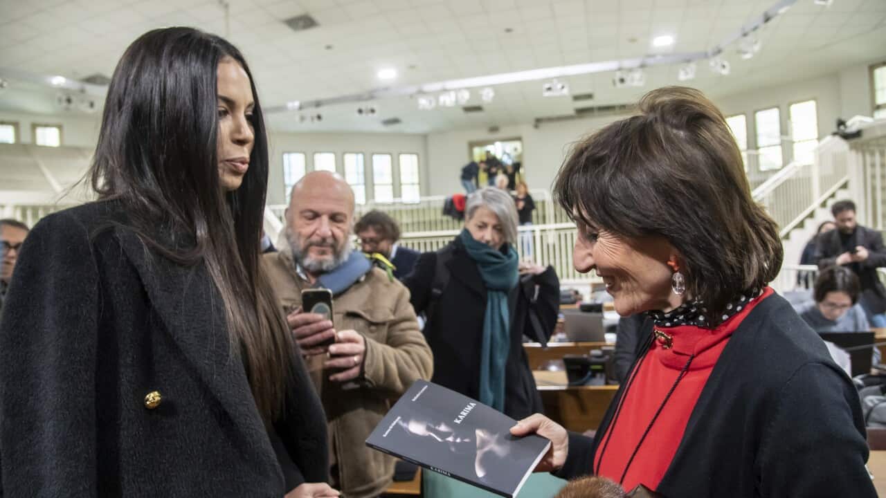 Karima El Mahroug, alias Ruby Rubacuori, consegna alla pm Tiziana Siciliano il suo libro autobiografico.