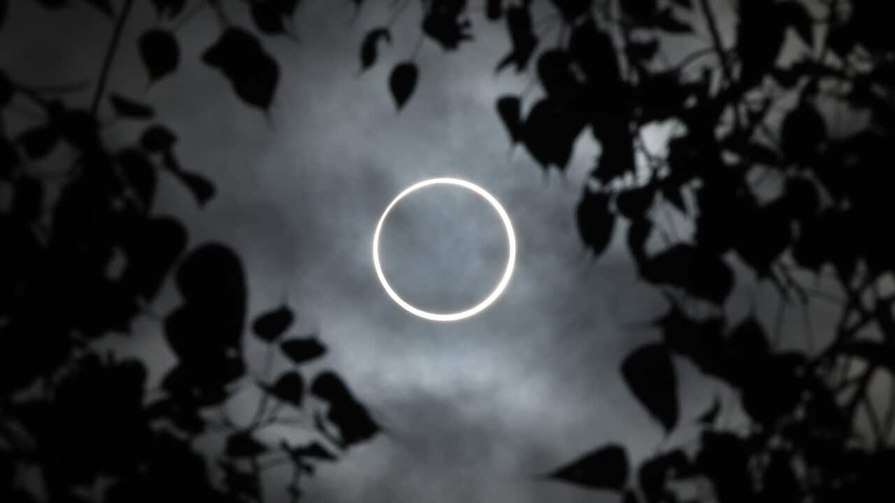 The moon totally covers the sun in a rare "ring of fire" solar eclipse as seen from the south Indian city of Dindigul.