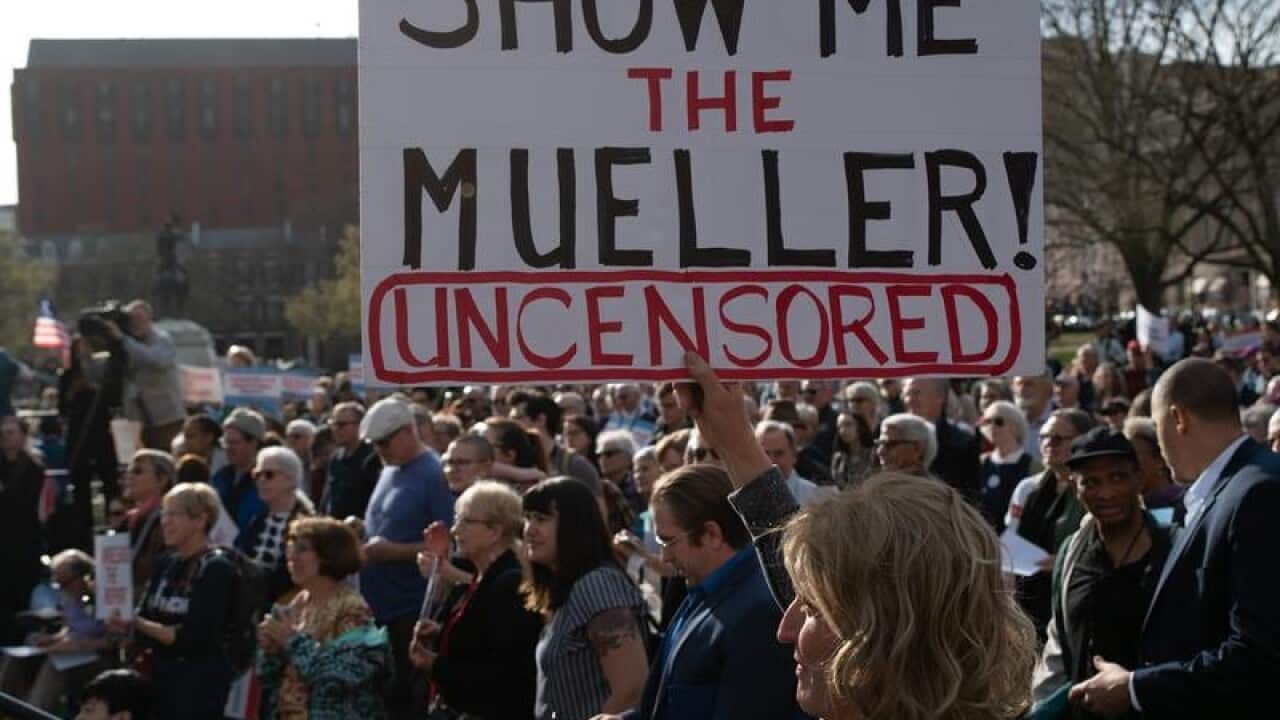 A file image of a protest calling for the release of the full report