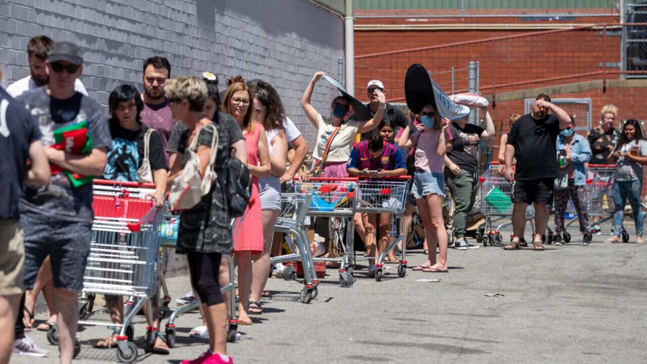 Long queues are seen outside Coles in Maylands, one of the potential exposure sites, in Perth, Sunday, 31 January, 2021.