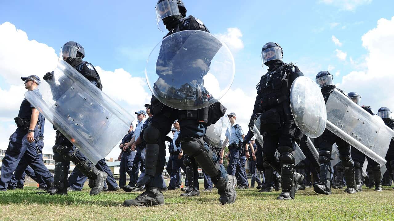 Queensland Police march during a G20 capability demonstration at the Queensland Police Service Academy in Brisbane, Thursday, May 22, 2014. (AAP Image/Dave Hunt)