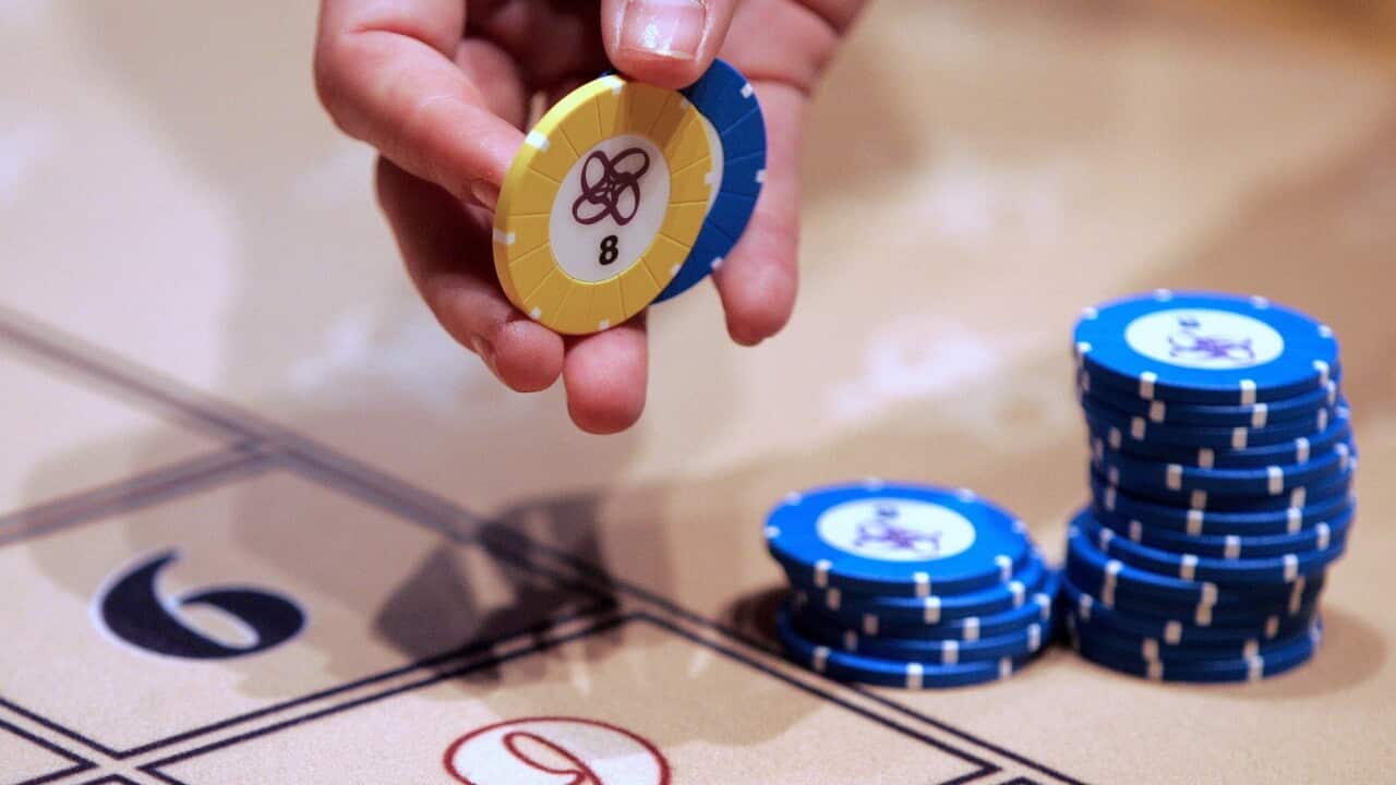 thumbnail_An increasing number of Australians are being harmed by gambling (AAP) (2).jpg