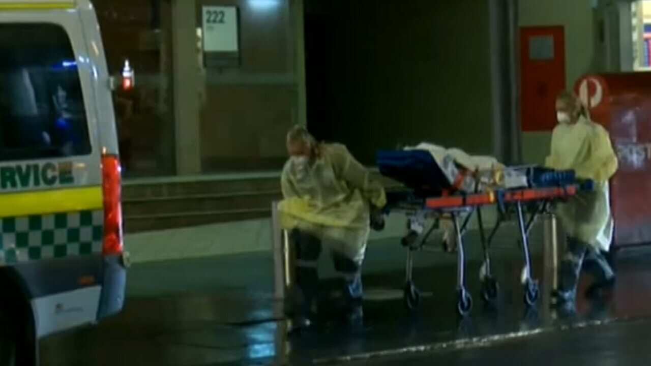 A child is taken from the Hilton Hotel in Sydney. (ABC)