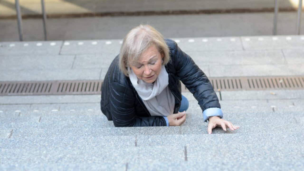 An older lady who has fallen up some steps