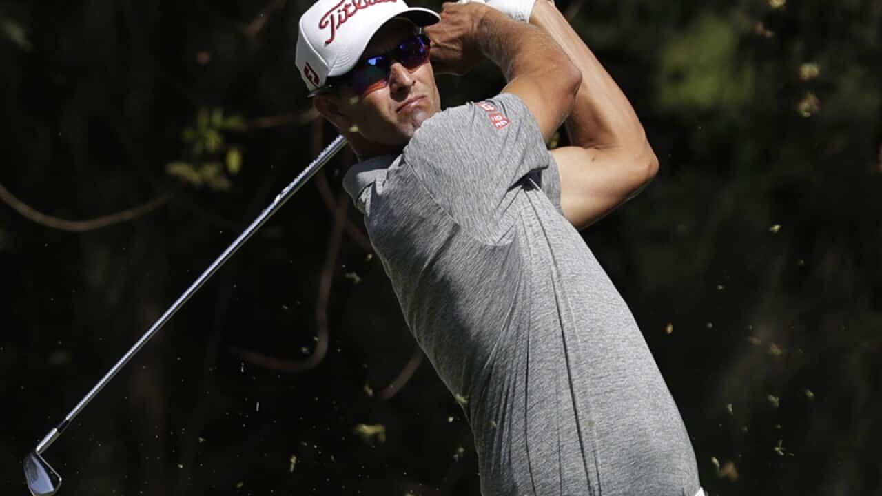 Defending champion Adam Scott, of Australia,