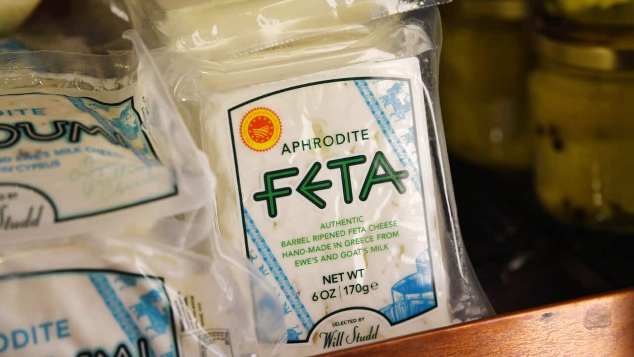 A block of feta cheese in a supermarket.