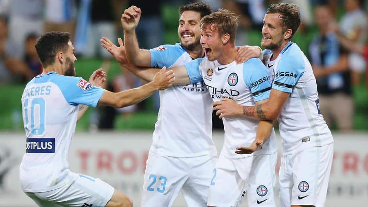 Melbourne City players rejoice after scoring another goal against Newcastle Jets
