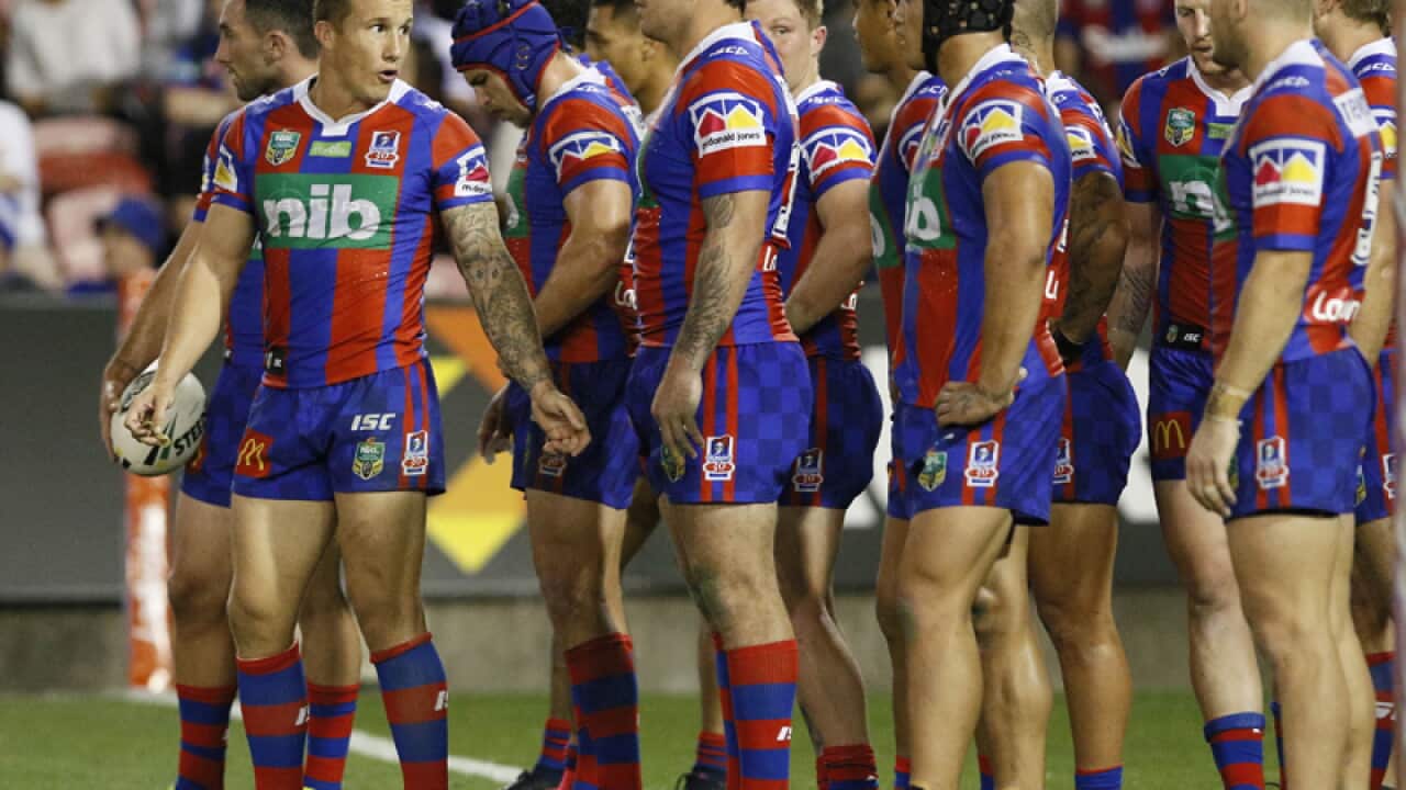 Trent Hodkinson of the Knights gives orders to the team