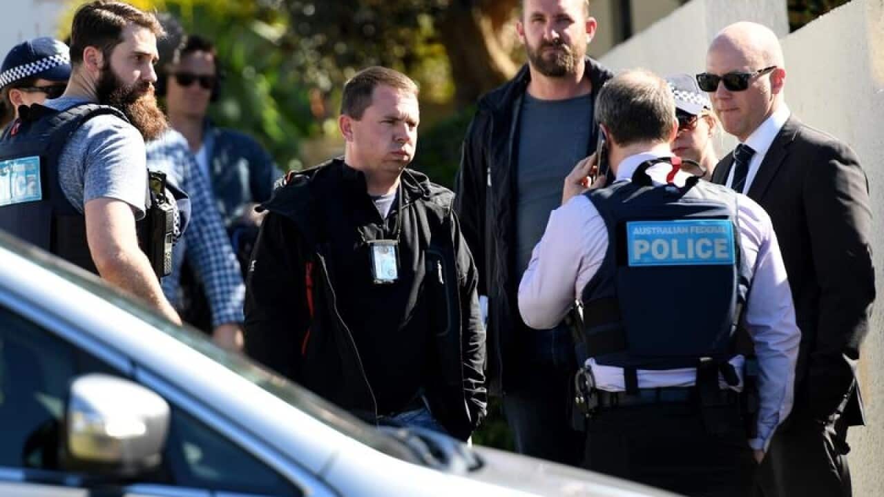Police are seen at the home of Kings Cross club owner John Ibrahim