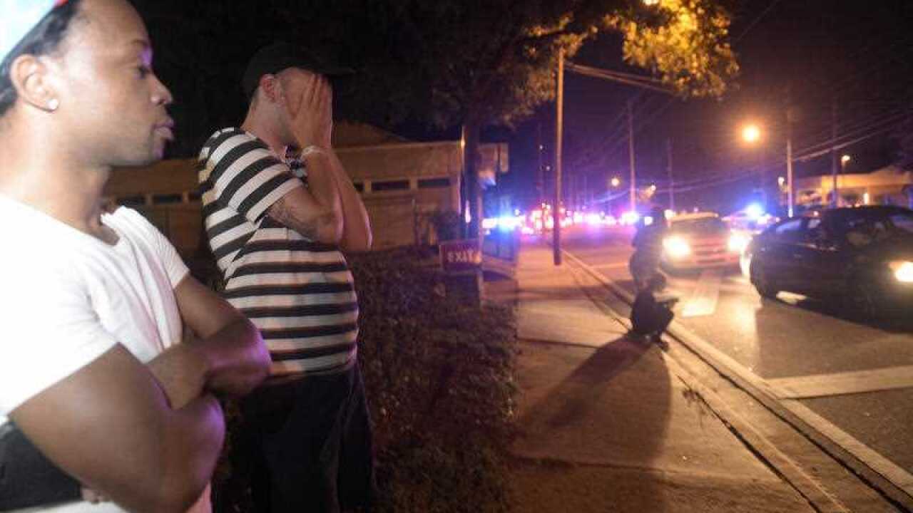 Concerned friends and family of victims at the Pulse nightclub wait outside of the Orlando Police Department