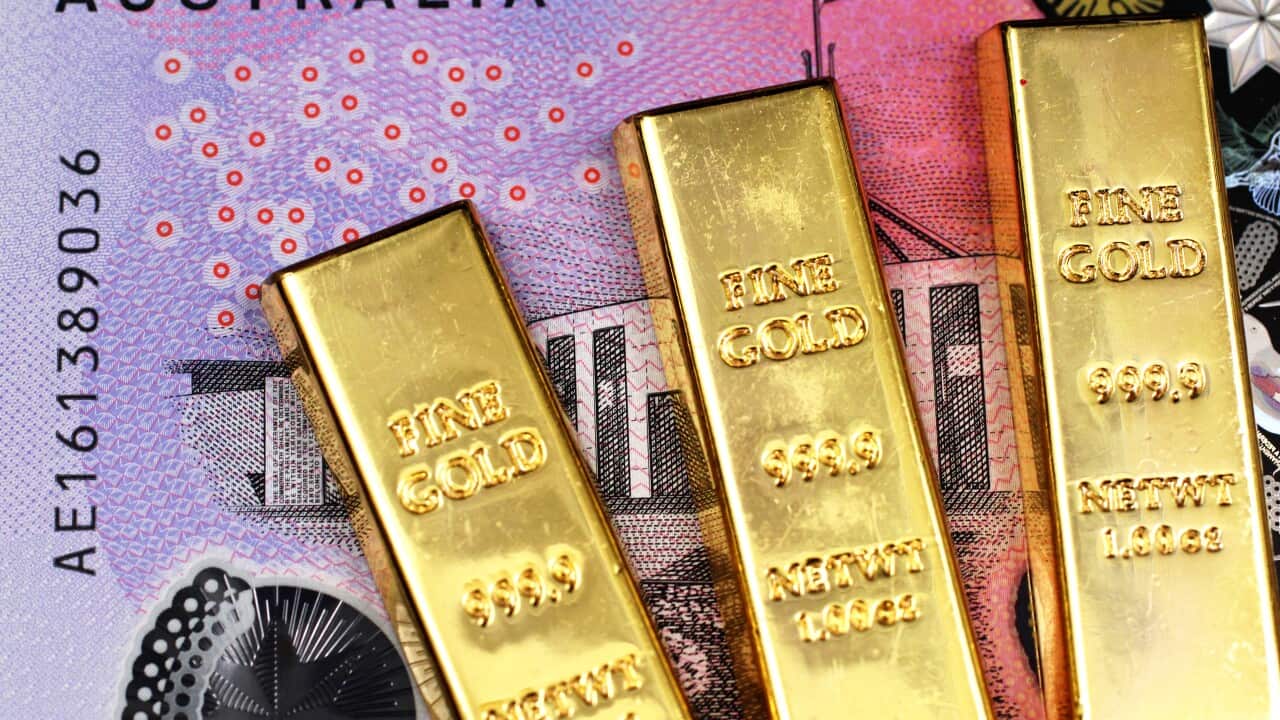 Macro image of a five Australian dollar bill with three small bars close up