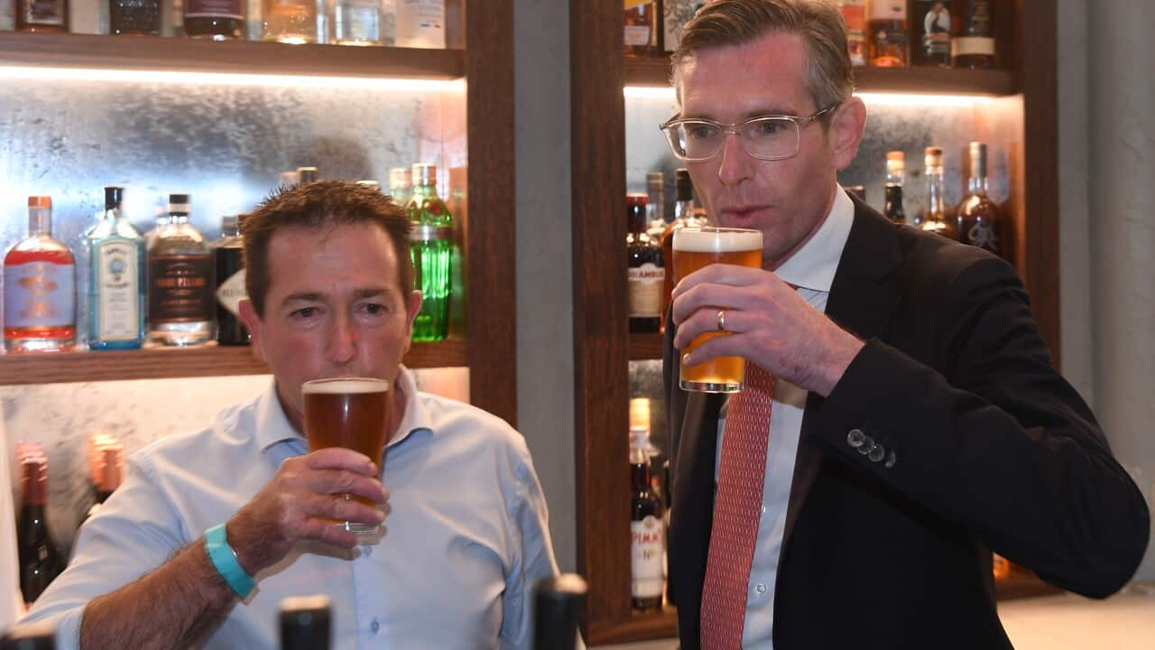 NSW Premier Dominic Perrottet and NSW Deputy Premier Paul Toole enjoy a beer at Watson's pub.
