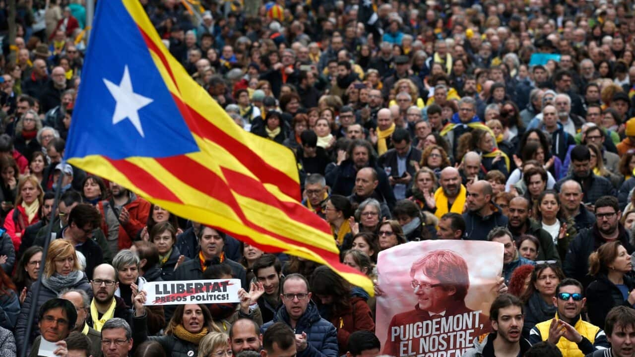 Protesters in Barcelona carried Catalonia flags and posters reading "Puigdemont, our President".