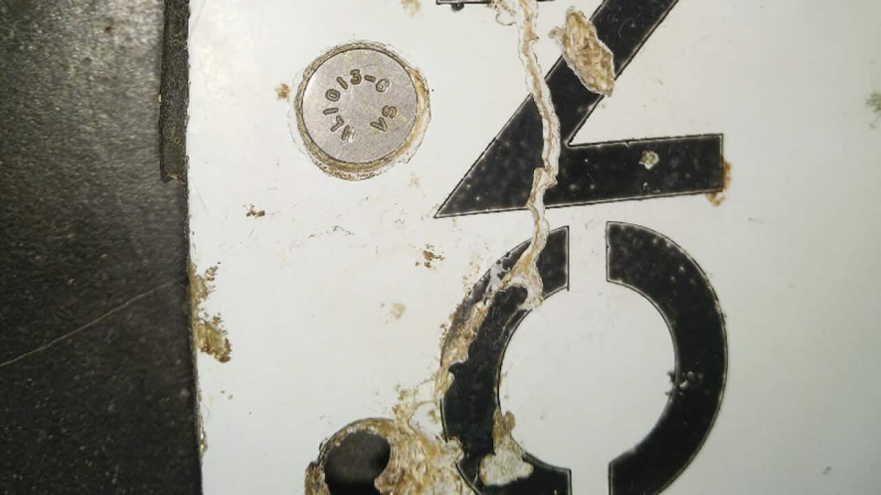 A piece of metal that has been found on a beach in Mozambique