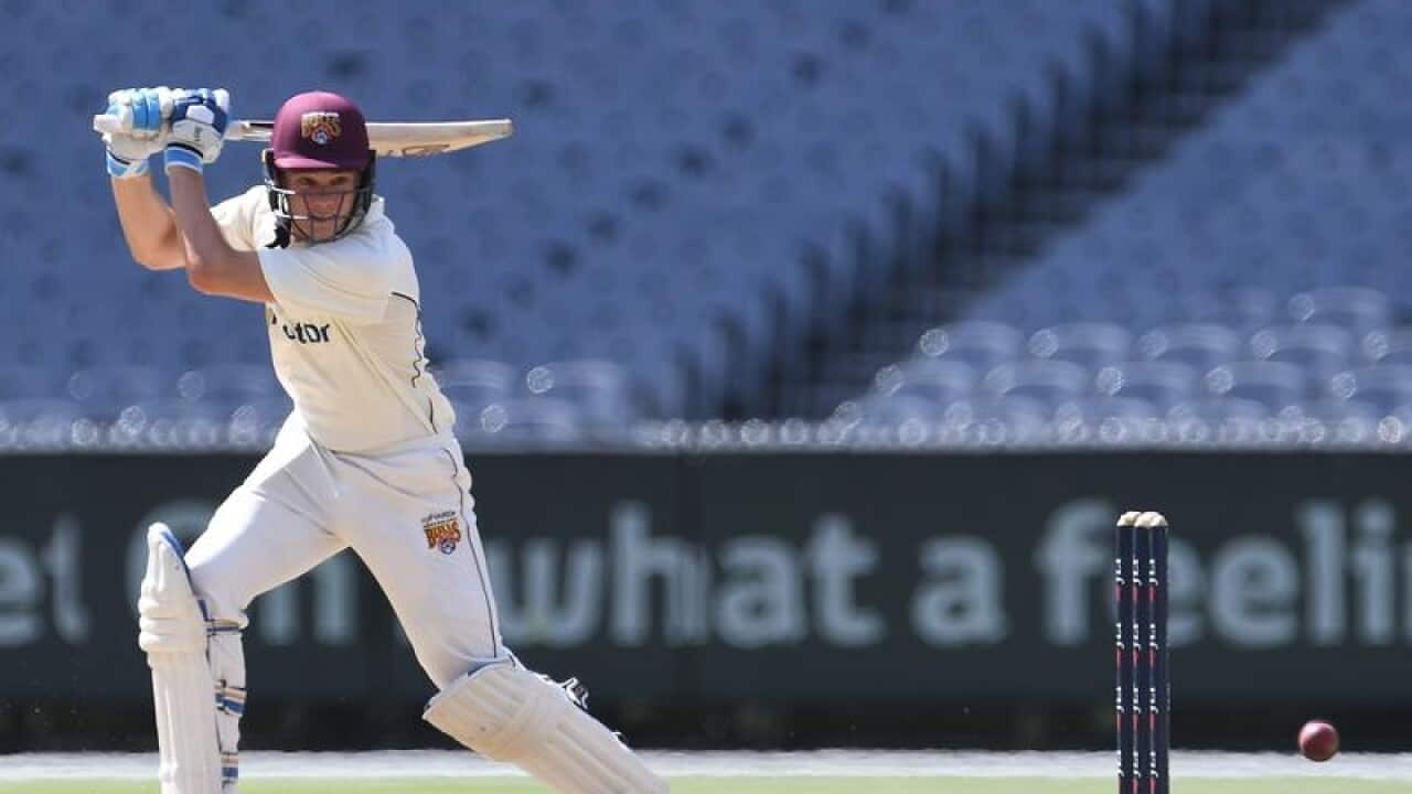 Queensland batsman Sam Heazlett plays a shot