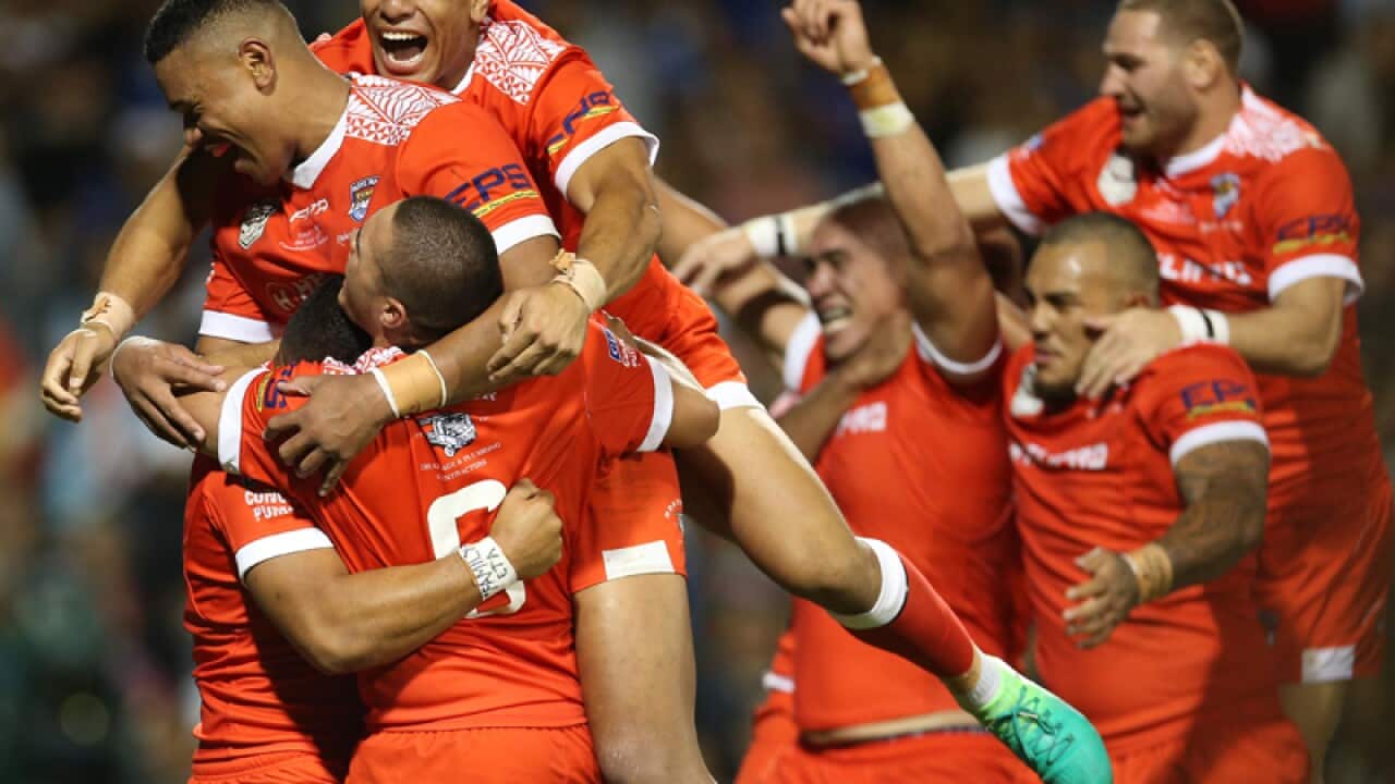 Tonga Mate Ma'a celebrate winning a try by Leilani Latu