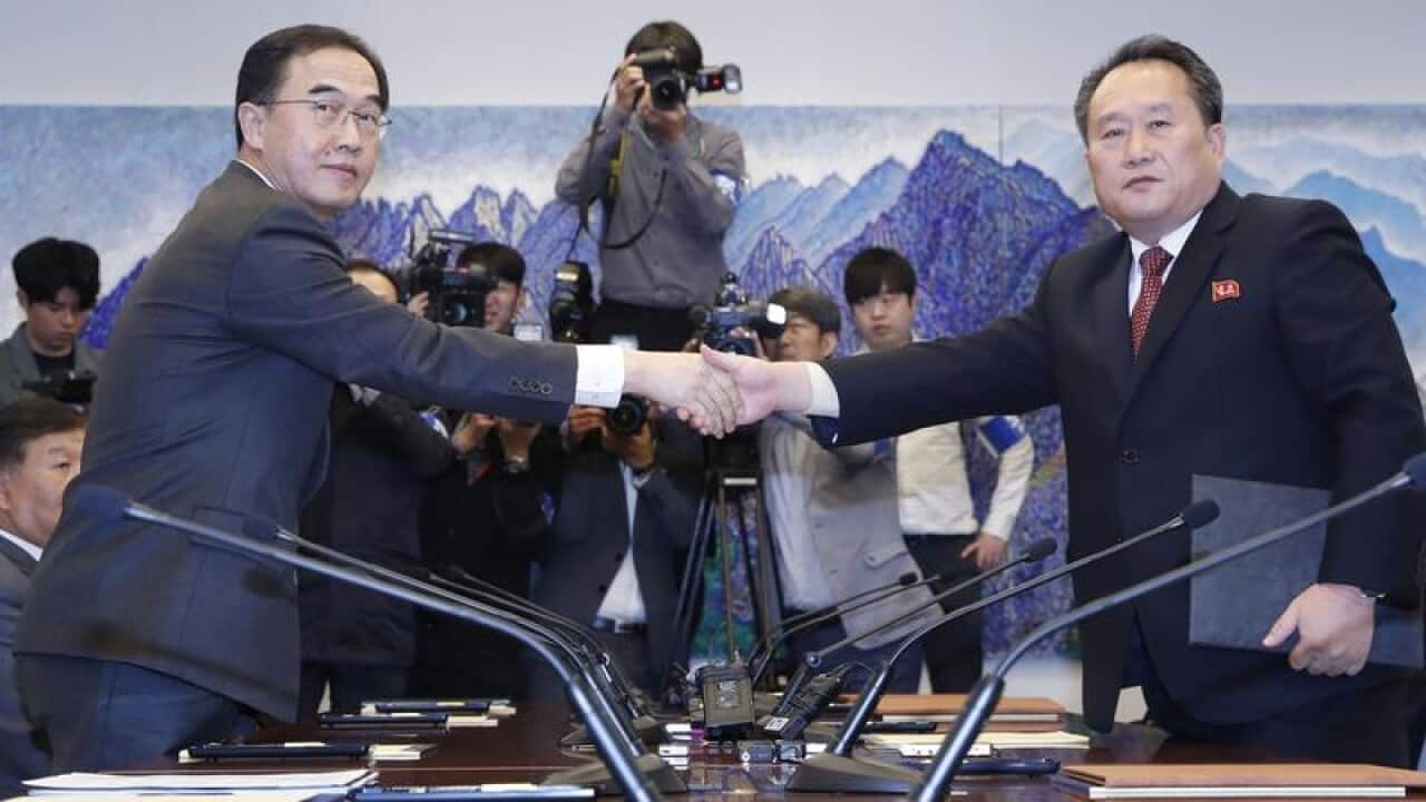 South Korea's Cho Myoung-gyon and North Korea's Ri Son Gwon.