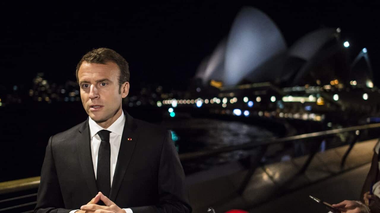 France's President Emmanuel Macron speaks to reporters in Sydney.