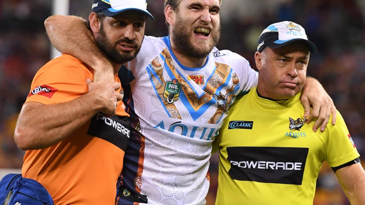 Titans player Ryan Simpkins is taken from the field after an injury