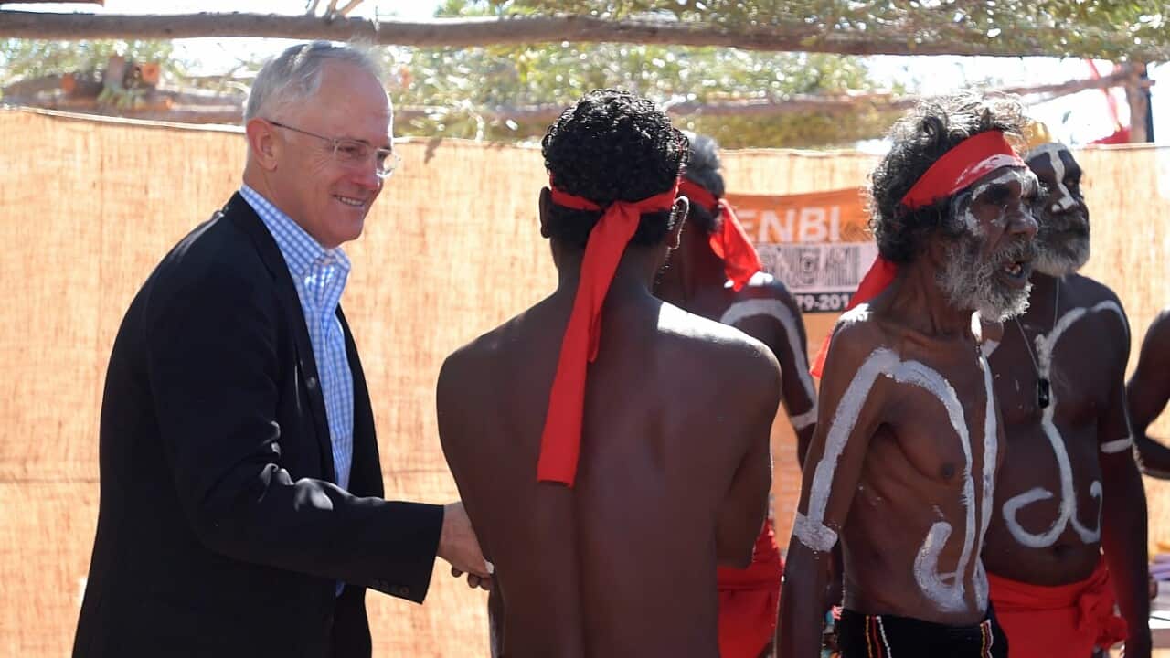 Australian Prime Minister Malcolm Turnbull greets aboriginal dancers as he attends the Kenbi Native land claim ceremony near Darwin, Tuesday, June 21, 2016.