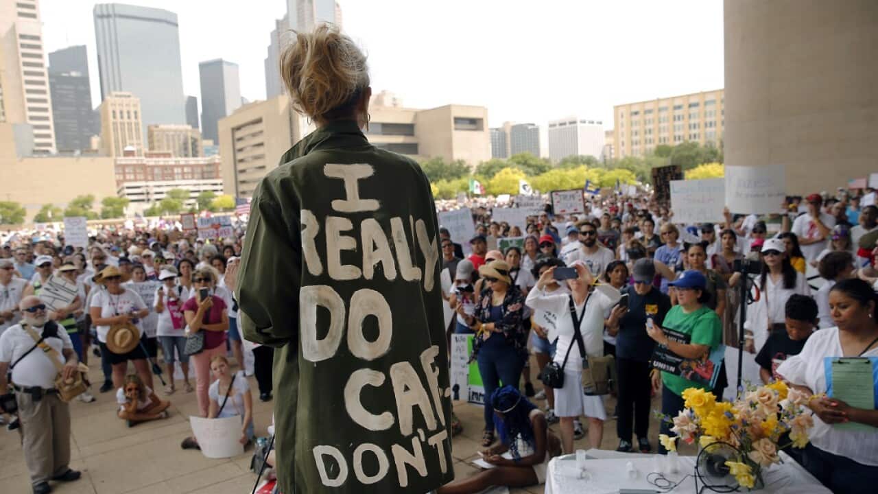 Actress and activist Cheryl Allison wore a "I Really DO Care, Don't U" green jacket as she spoke during the Keep Families Together rally at Dallas.