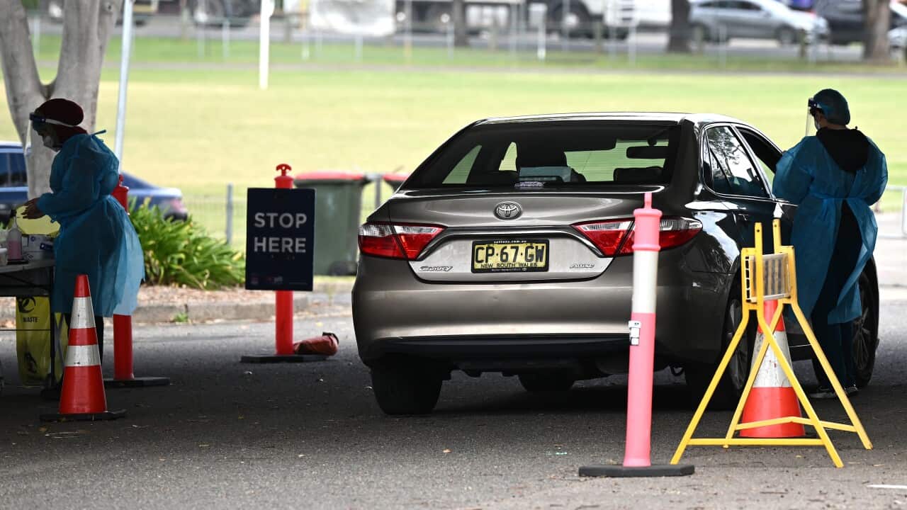 A car parked at a drive-thru COVID-19 testing centre.