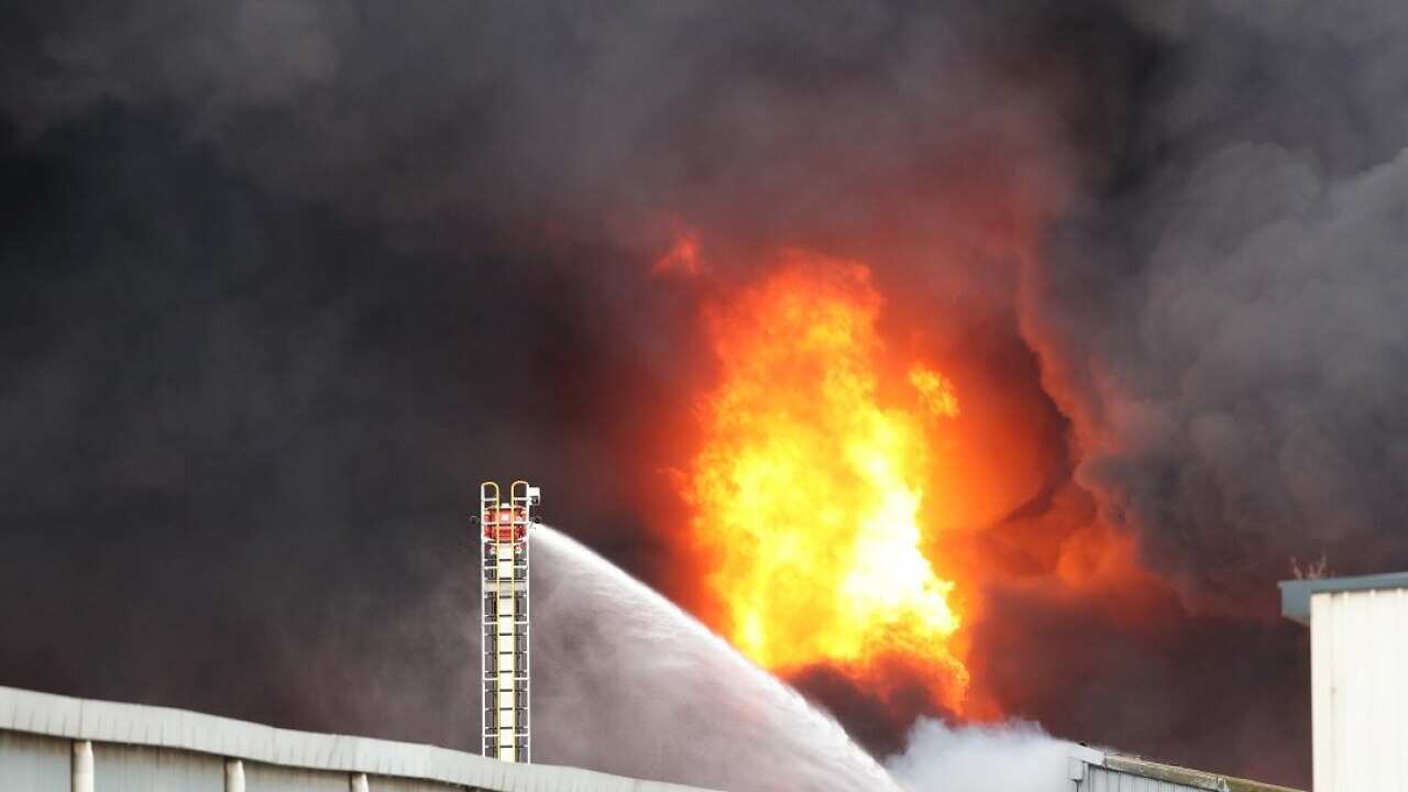 Fire crews battle to control a blaze at a factory in West Footscray, Melbourne, Thursday, August 30, 2018. More than 20 fire trucks are at the site where the sounds of explosions can be heard. (AAP Image/David Crosling) NO ARCHIVING