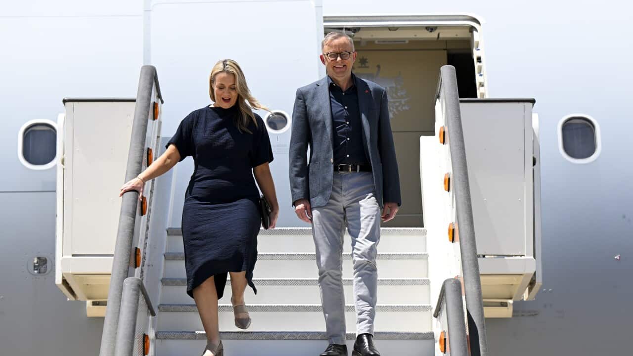 Australian Prime Minister Anthony Albanese and partner Jodie Haydon disembark from the plane after arriving in Madrid for the NATO summit.