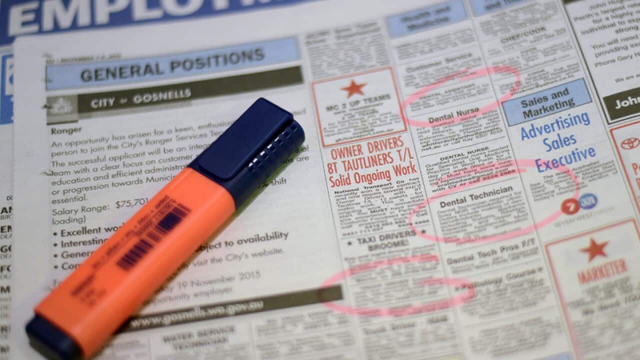 Job adverts are seen in a weekend newpaper