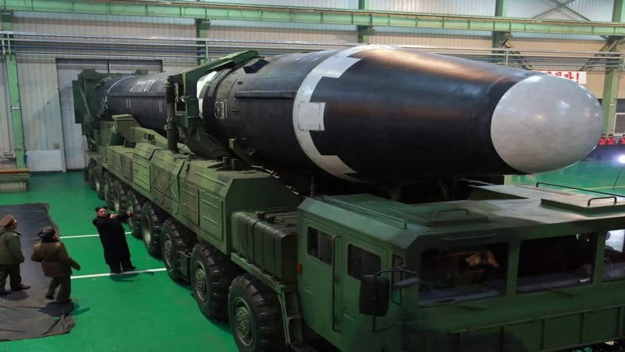 Kim Jong Un examining North Korea's intercontinental missile