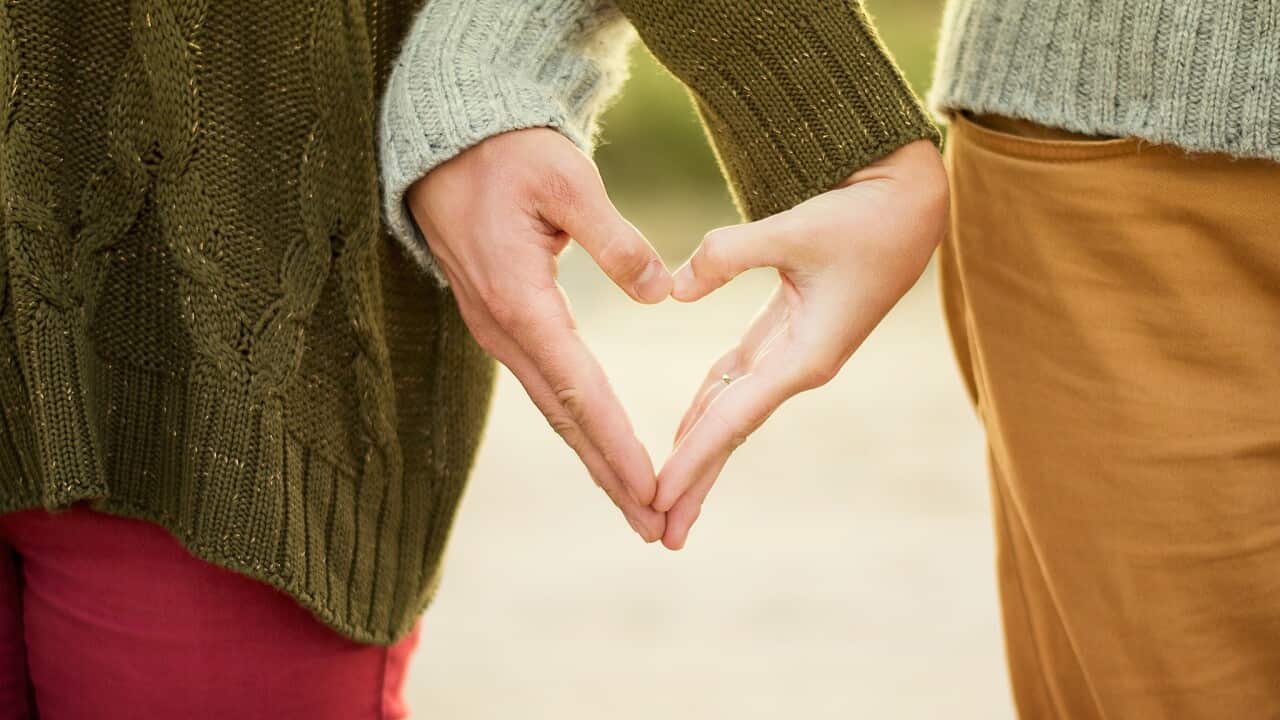 Couple holding hands