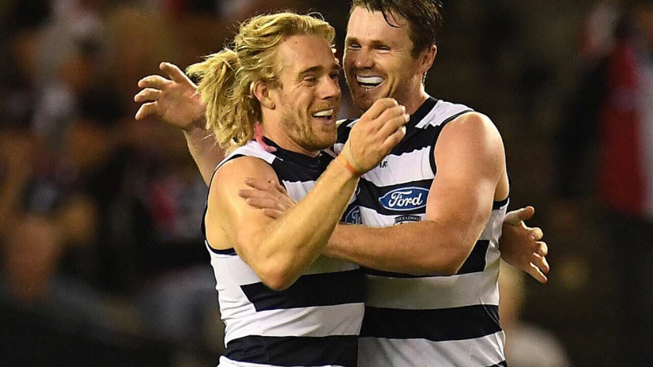 Cameron Guthrie (left) and Patrick Dangerfield of the Cats