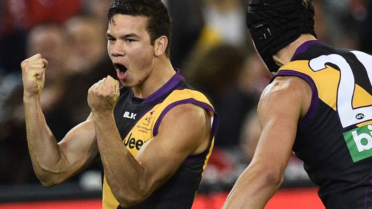 Daniel Rioli (L) and Ben Griffiths of the Tigers
