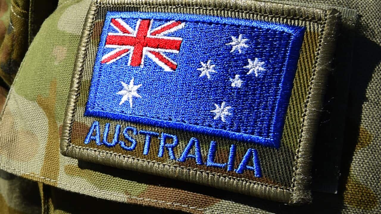 An Australian flag on a defence force uniform
