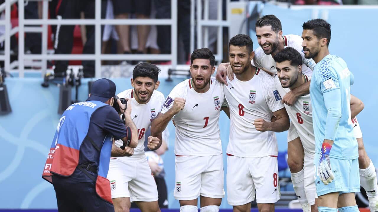 Iranian men's football team wearing white jerseys