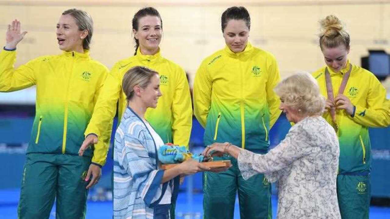 Annette Edmondson, Amy Cure, Ashlee Ankudinoff and Alexandra Manly of Australia are seen with The Duchess of Cornwall (right,front) as they celebrate the Women's 4000m Team Pursuit Finals on day one of the XXI Commonwealth Games, at the Gold Coast.