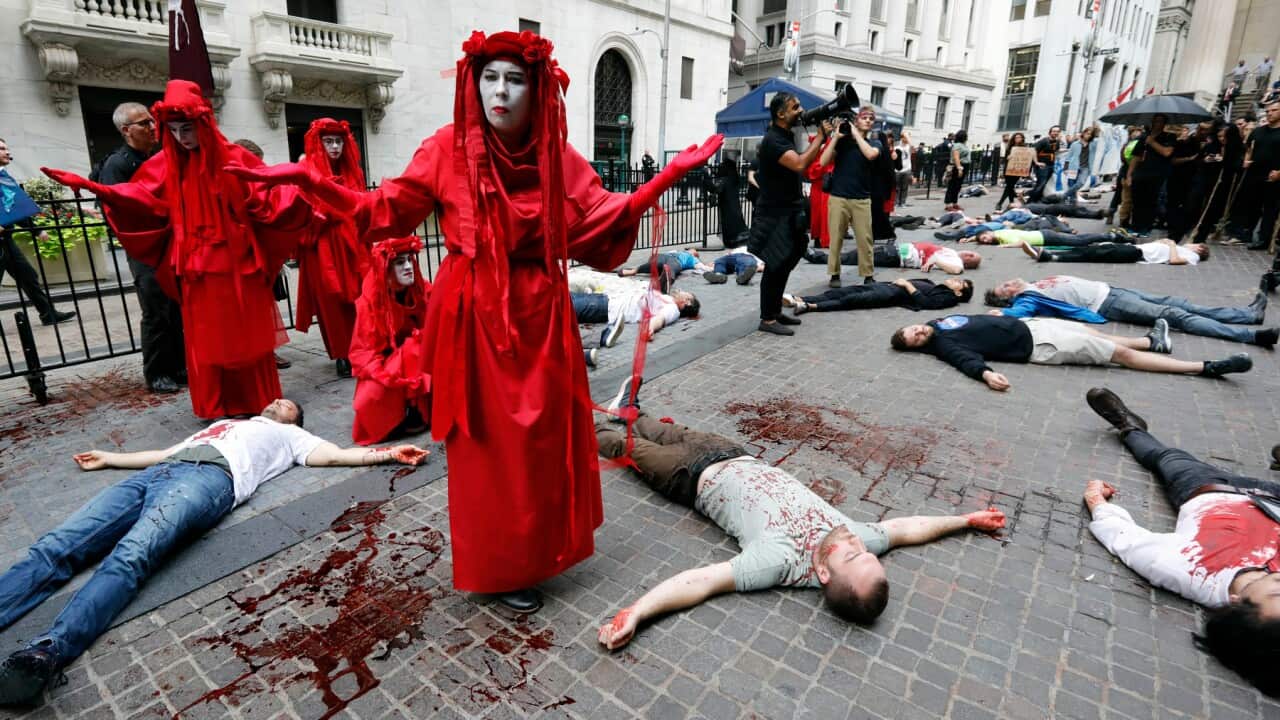 Activists with the Extinction Rebellion movement demonstrate outside the New York Stock Exchange
