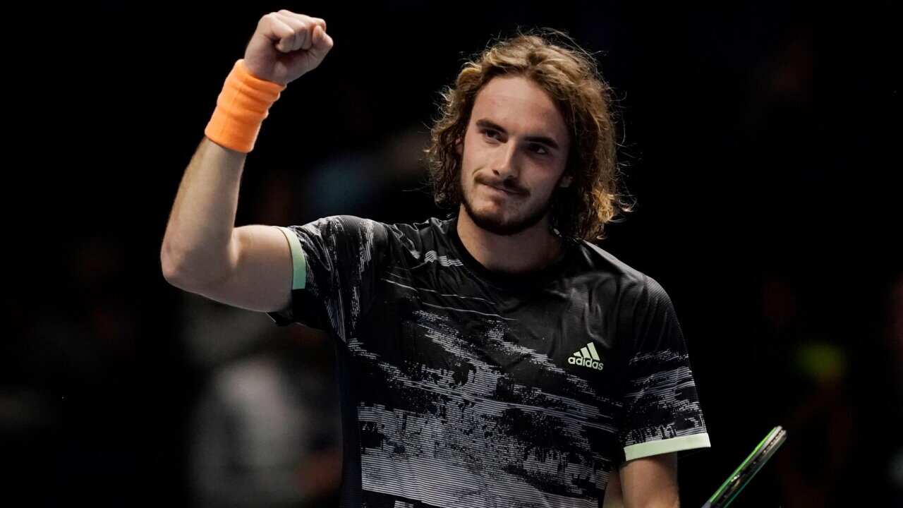 Stefanos Tsitsipas reacts after winning his round robin match against Alexander Zverev at the ATP Finals tennis tournament in London.