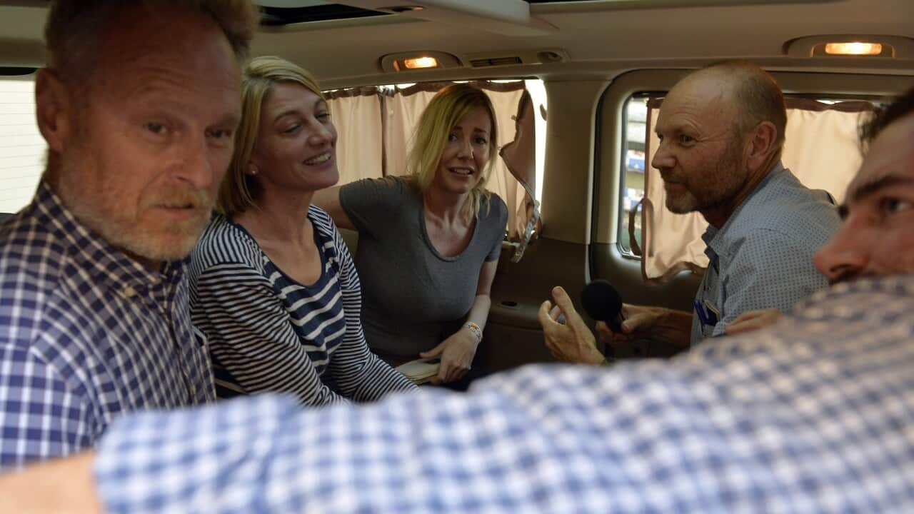 Members of Australian '60 Minutes' television crew greet Australian Sally Faulkner (C) and Australian reporter Tara Brown (2-L) after they left Baabda Prison