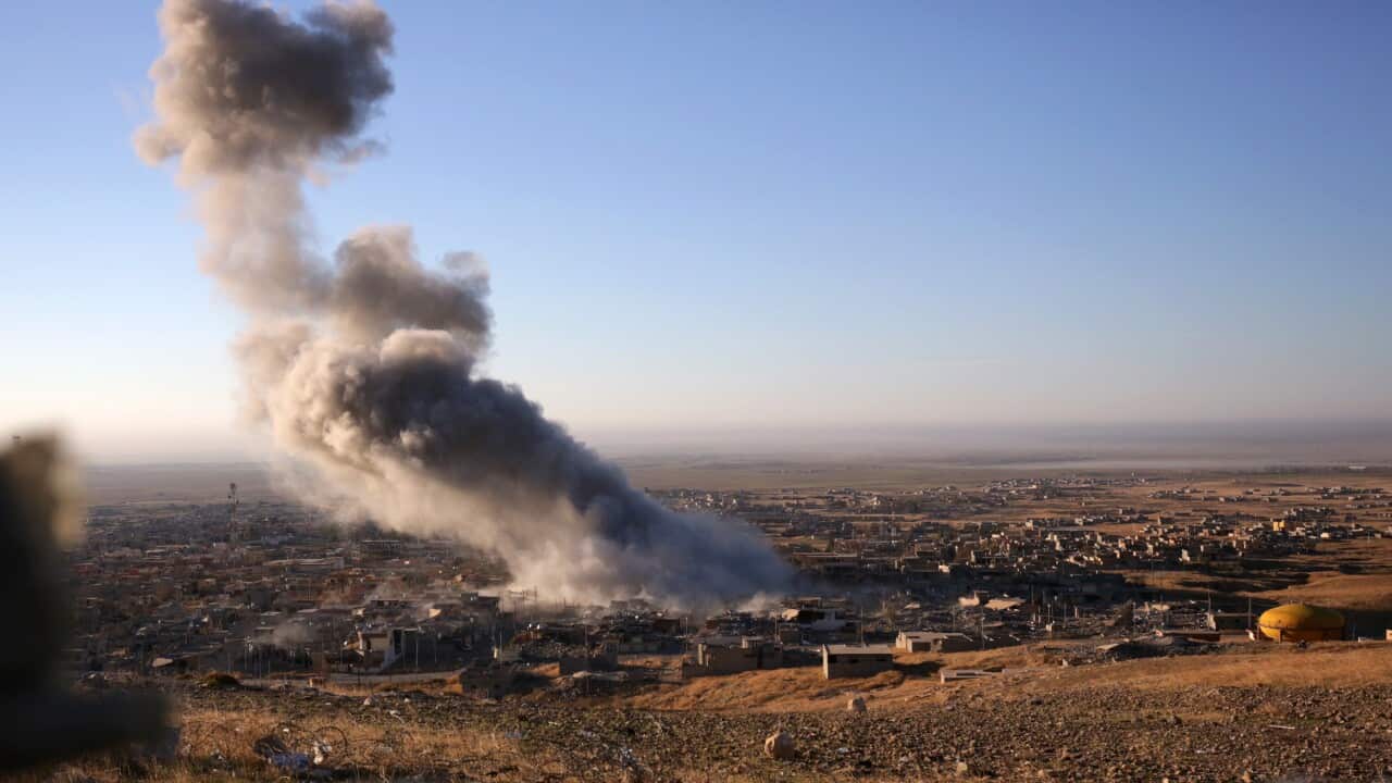 Smoke believed to be from an airstrike billows over the northern Iraqi town of Sinjar on Thursday, Nov. 12, 2015. (AP)