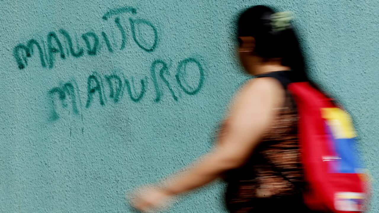 Graffiti that reads 'Damned Maduro', in Caracas, Venezuela