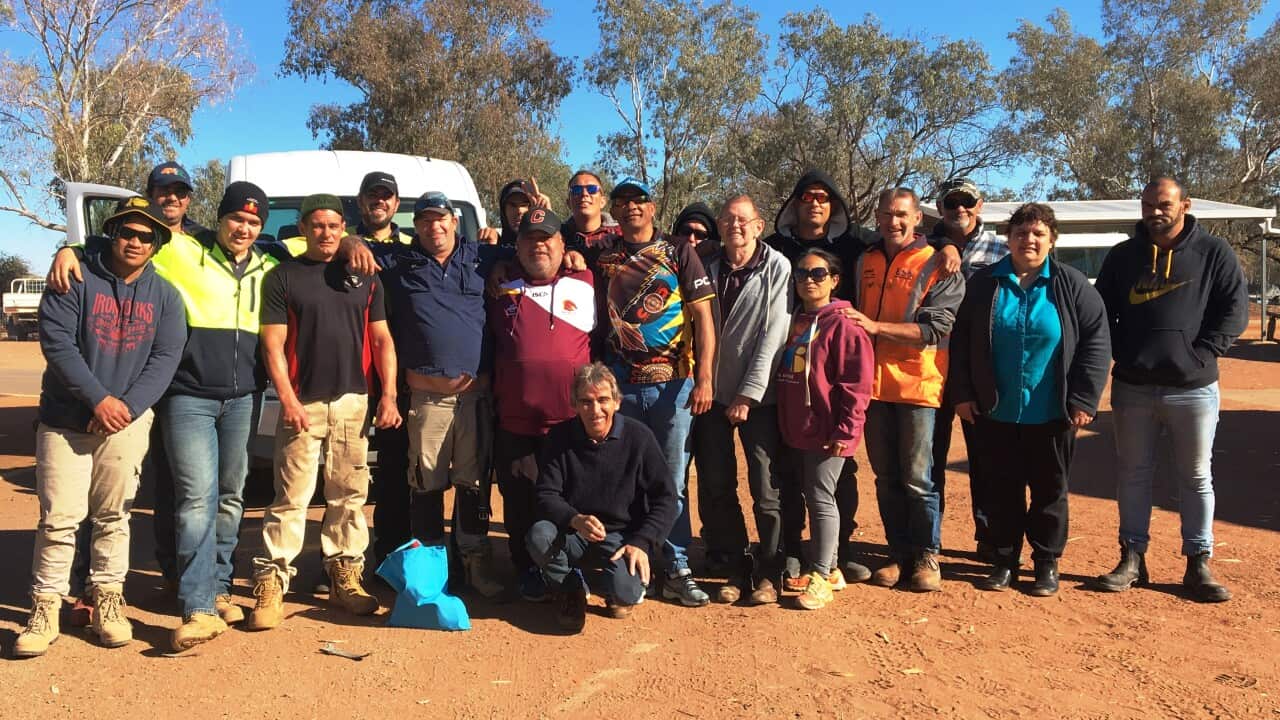 Orana Haven CEO Alan Bennett (kneeling) with group at the rehabilitation centre