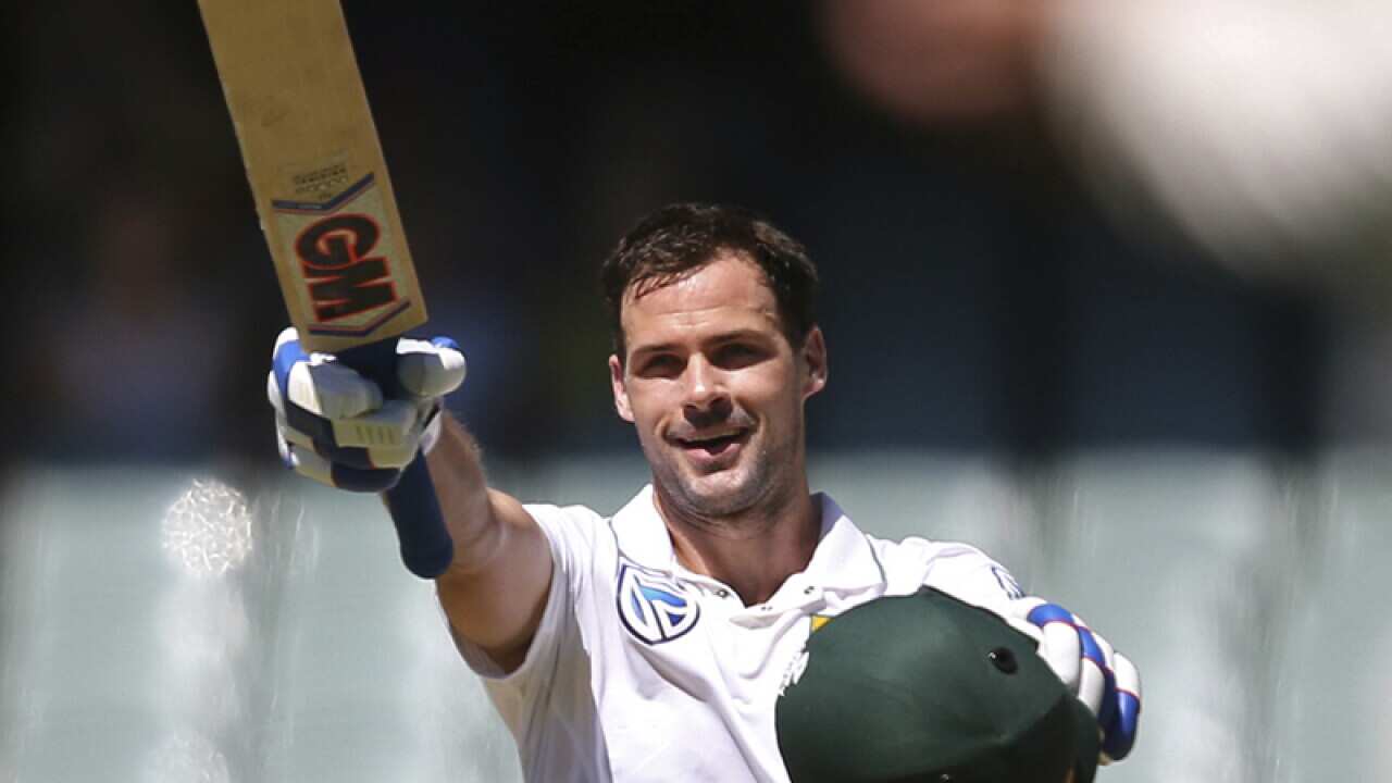 South Africa's Stephen Cook raises his bat after making 100 runs