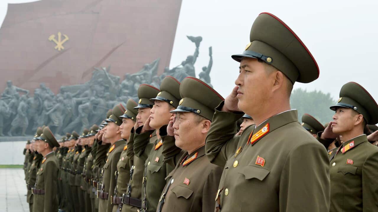 North Korean soldiers salute at Munsu Hill in Pyongyang, North Korea to mark the 69th anniversary of the country's founding Saturday, Sept. 9, 2017. (Kyodo News via AP)