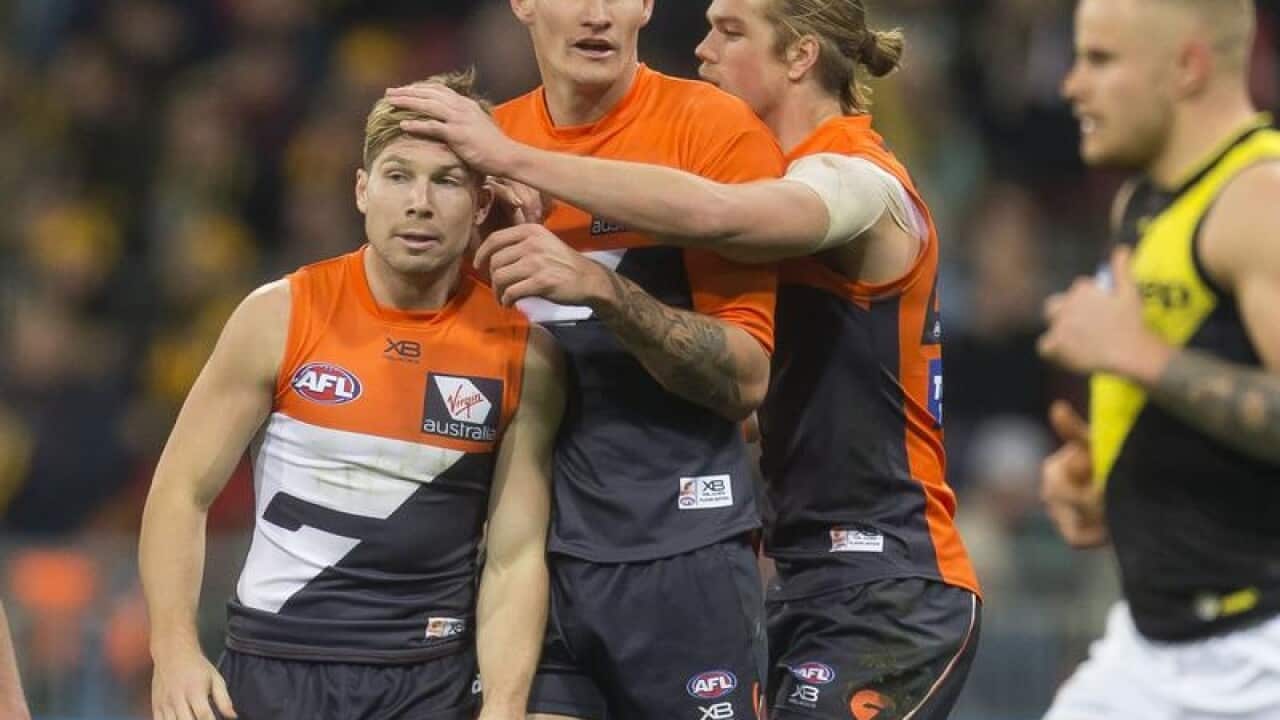 Toby Greene of the Giants celebrates after kicking a goal.