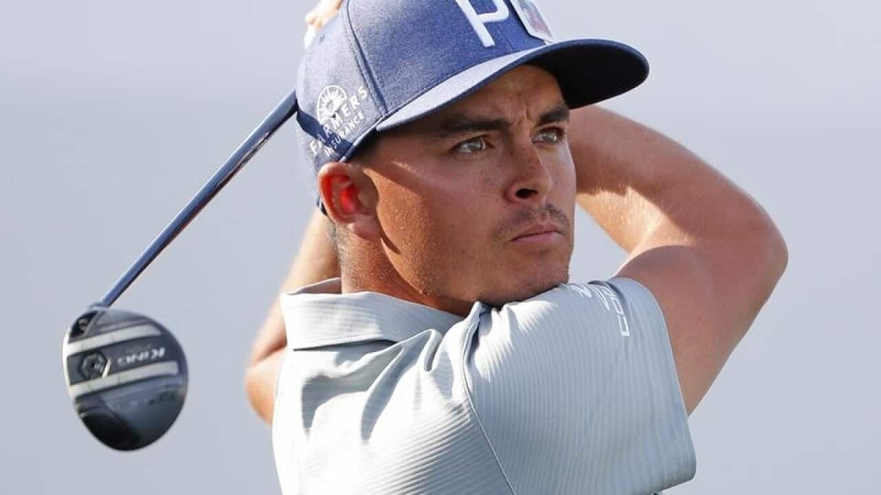 Rickie Fowler tees off on the 17th hole.