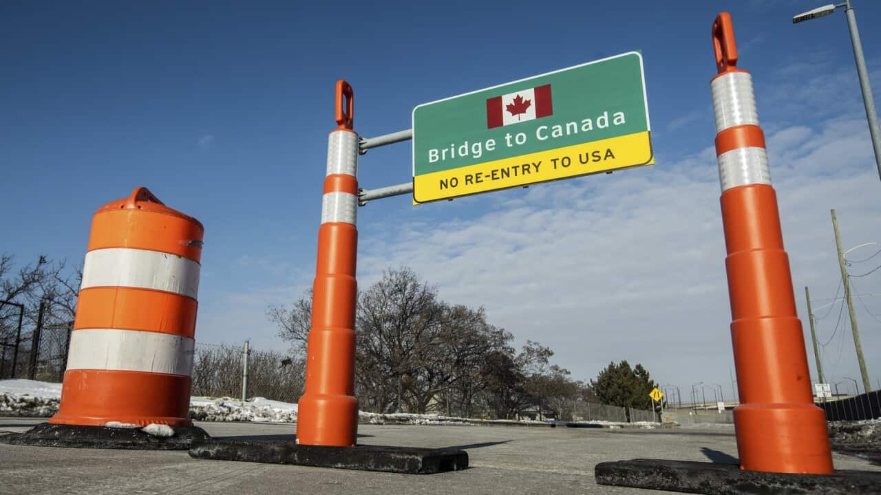 Cones block an entrance to the Ambassador Bridge entrance to Canada from Detroit