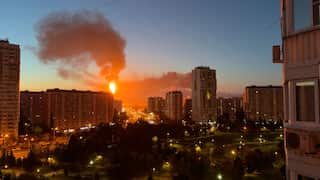 Smoke and fire rising from an apartment building after a drone attack in Moscow
